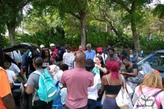 Shirt Off My Back (Handing our clothing -crowd around van)